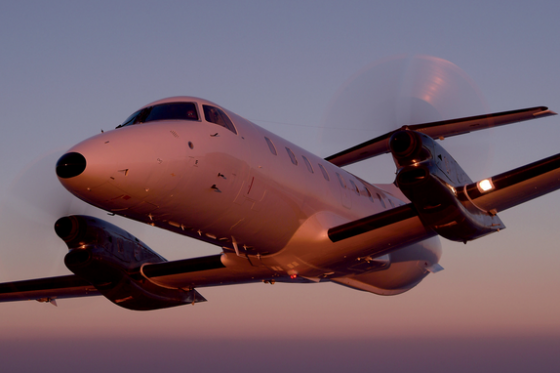 Embraer EMB-120 Brasilia in flight at sunset