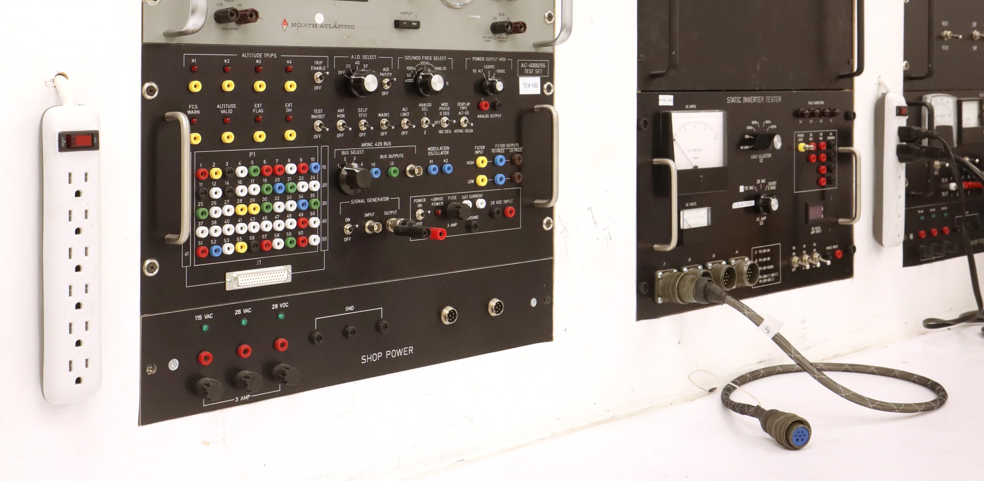 Avionics test bench at Sunshine Air Repairs with phase angle voltmeter, ALT-4000/55 air data test set and static inverter tester